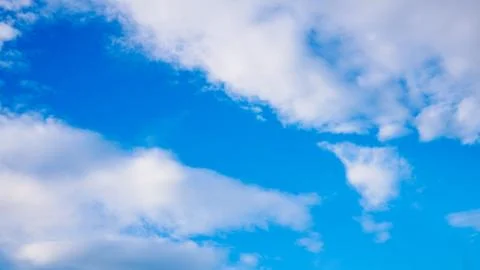 Blue cloudy sky in winter time Stock Photos