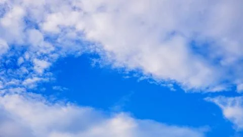Blue cloudy sky in winter time Stock Photos
