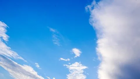 Blue cloudy sky in winter time Stock Photos