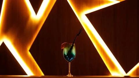 Blue cocktail with straw on background Stock Photos