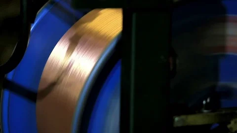 With blue coil machine unwinds copper cable Stock Footage 76951008