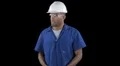 Blue collar worker - break time - removes helmet and puts safety glasses away HD Footage