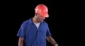 Blue collar worker - break time - pulls banana from pocket HD Footage