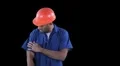 Blue collar worker start cleaning his jump suit with roller - shoulders HD Footage