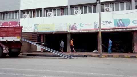 Blue collared workers unloading  construction steel materials in Mysuru. Stock Footage 153961566