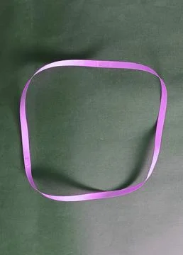 Blue color different shape mobius strip or band isolated on brown background 스톡 사진
