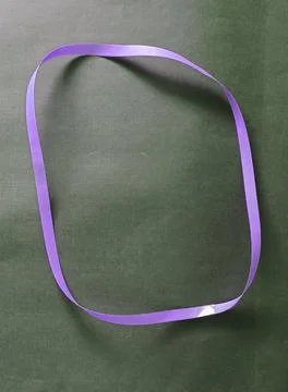 Blue color different shape mobius strip or band isolated on brown background 스톡 사진