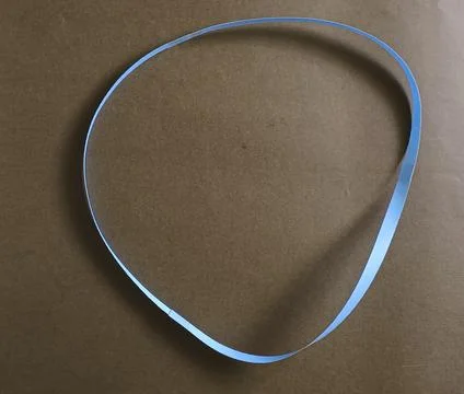 Blue color different shape mobius strip or band isolated on brown background Stockfoto's