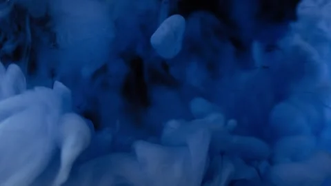 Blue color ink exploding in water over black background. Stock Footage 276187123