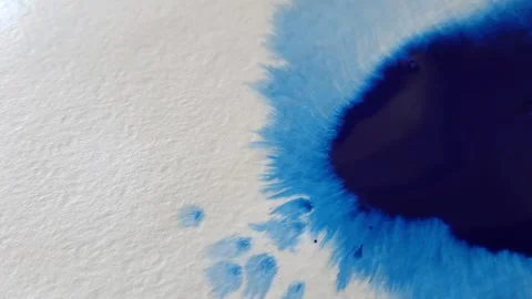 Blue color inks spreading out over wet paper background Stock Footage 277960838