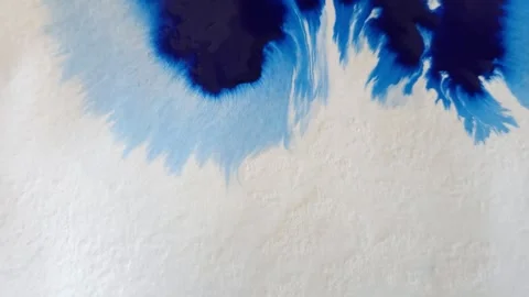 Blue color inks spreading out over wet paper background Stock Footage 277960841