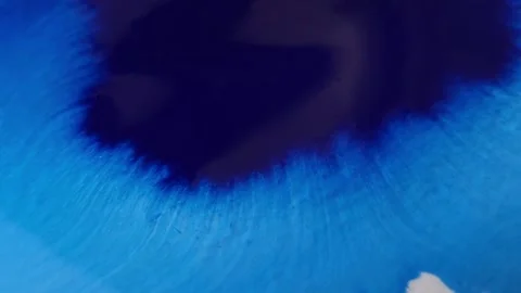 Blue color inks spreading out over wet paper background Stock Footage 277960846