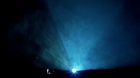 Blue color projector light beam trough smoke and dust Stock Footage 89551314