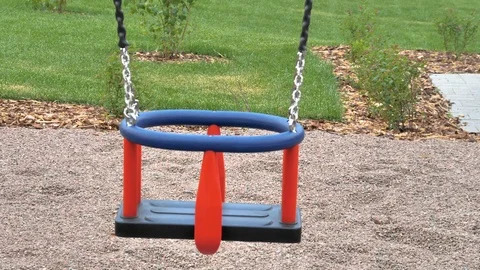 The blue color swing on the playground Stock Footage 116489906