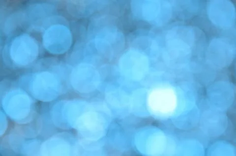 Blue colored abstract background with bokeh Stock Photos