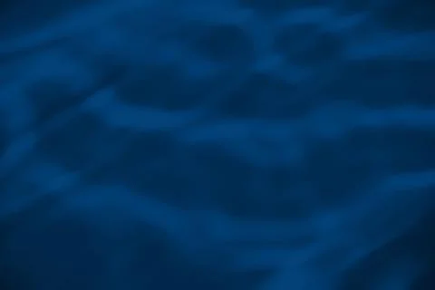 Blue colored abstract background with light and shadows caustic effect Stock Photos