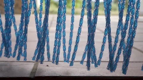 Blue colored fly mosquito net door curtain detail, close up Stock Footage 231553232