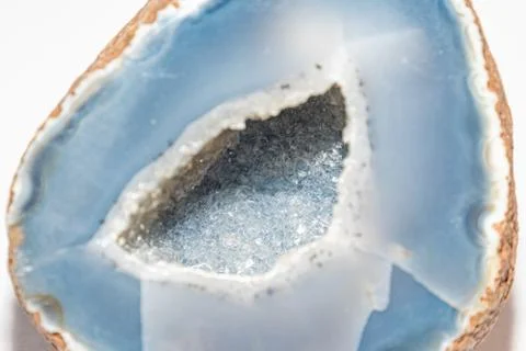 Blue colored geode outside looking like usual rock inside full of small shiny Foto stock