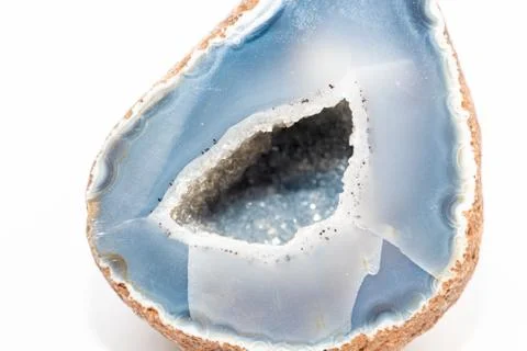 Blue colored geode outside looking like usual rock inside full of small cryst Stock Photos