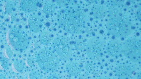 Blue colored ink floating background texture Stock Footage 204849948
