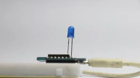 Blue colored led blinking light that is controlled by a micro controller Stock Footage 327978340