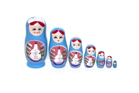Blue colored nesting dolls on a white background. Russian national souvenir. Stock Photos