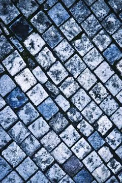 Blue colored stone paving blocks Stock Photos