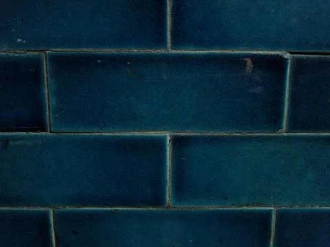Blue colored wall with bricks background picture, texture, wallpaper, shades  Stock Photos