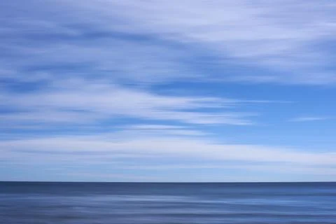 Blue colour background, beach with clouds and sky Stock Photos