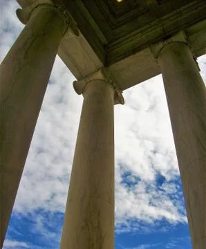 BLUE COLUMNS REACHING UP AT THE BLUE CLOUDY SKY Fotos Stock
