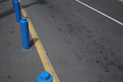 Blue columns on the road Stock Photos