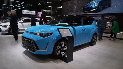 Blue Compact Car Displayed at the Exciting Auto Show Gathering Enthusiasts Vídeo Stock 291616713