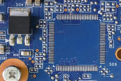 Blue computer board with capacitors and desoldering for a microprocessor Stock Photos