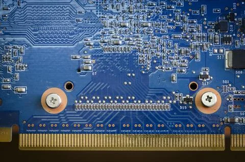Blue computer board with capacitors, microchip and gold-plated connector Stock Photos