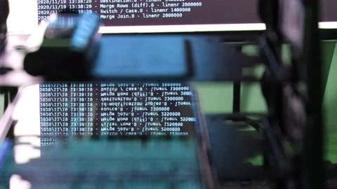 Blue computer software code moving on a black monitor reflect on glass. Abstr Stock Footage 143871813