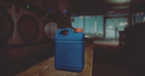 Blue container resting on wooden table in a dimly lit laundry room Illustrazione stock