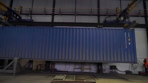  The blue container is suspended on a crane beam. Stock Footage 105228406