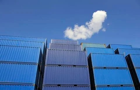 Blue containers waiting to be loaded Stock Photos