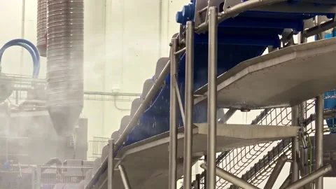 Blue conveyor system inside a hygienic processing facility with stainless steel Stock Footage 334020500