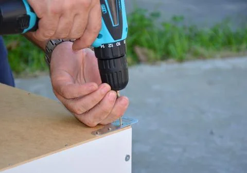 Blue cordless screwdriver with a bit. Stock Photos