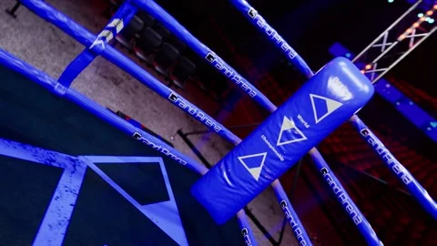 Blue corner of empty boxing arena in the light of a spotlight 4k video footage Stock Footage 152727449