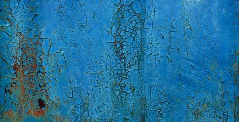 Blue coroded metal sheet background with peeling paint flakes Stock Photos