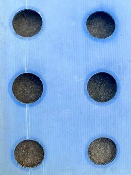 Blue Corrugated Plastic Mulch Sheet with Planting Holes on Soil Grid Layout Stock Photos
