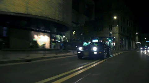 Blue Corvette overtaking and driving through old city Vídeos de archivo 33003902