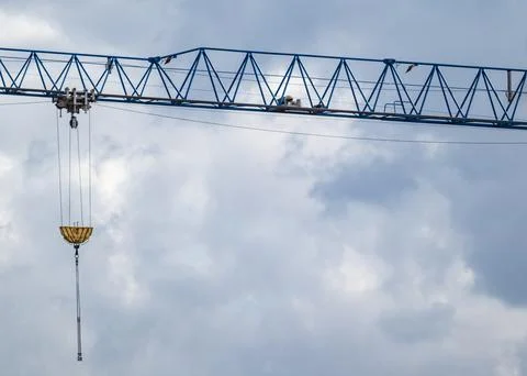 Blue crane projecting arm for lifting weights Stock Photos