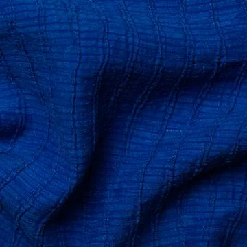 Blue crumpled fabric texture. Abstract background and texture for design Stock Photos