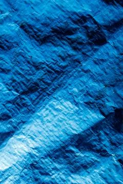Blue crumpled material texture, abstract background, artistic design element Stock Photos