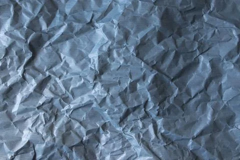 Blue crumpled paper texture with subtle horizontal stripes Stock Photos
