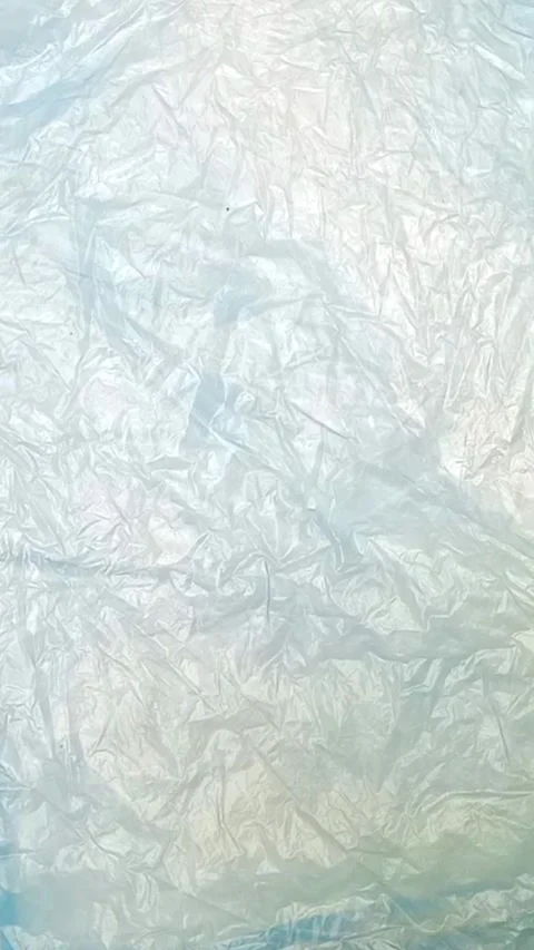 Blue crumpled plastic bag texture background rotating. Low-Density Polyethylene Stock Footage 316378292