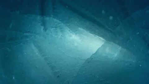 Blue crushed ice texture background on water surface with underwater lights Stock Footage 231394387